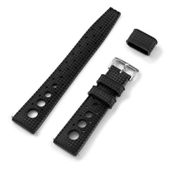 A black tropic rubber watch strap with a steel buckle, displayed with three different loop configurations.
